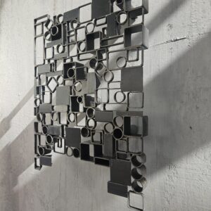 steel wall relief sculpture sandy bruns close up